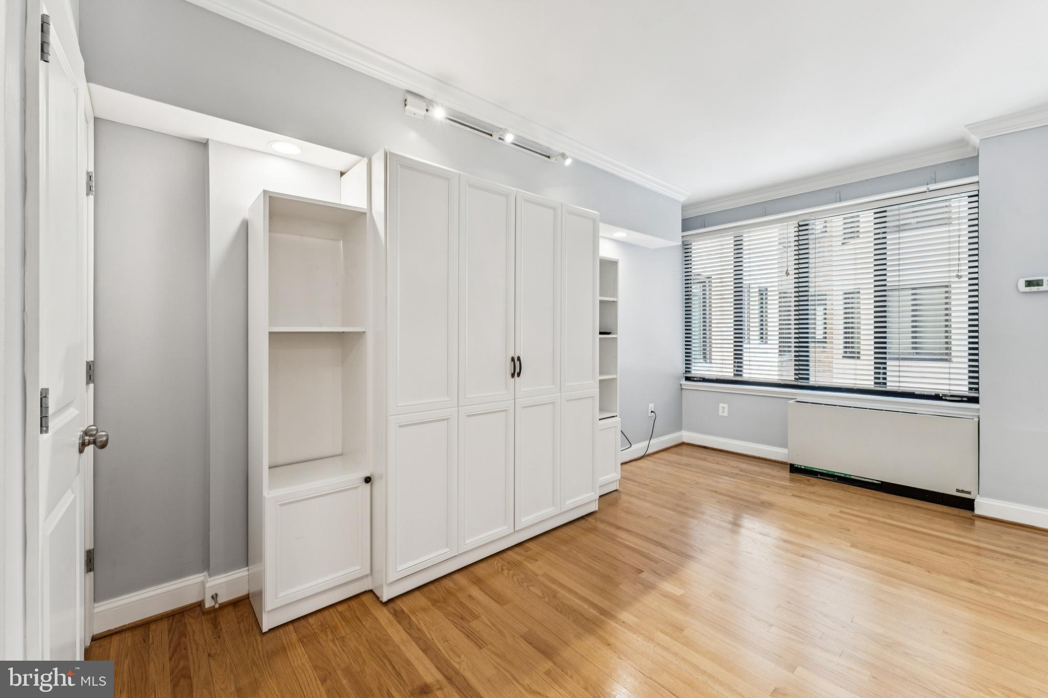 1701 16th Street Northwest, Unit 304 Washington, DC 20009 - Photo 2 of 15 a view of an empty room with wooden floor
