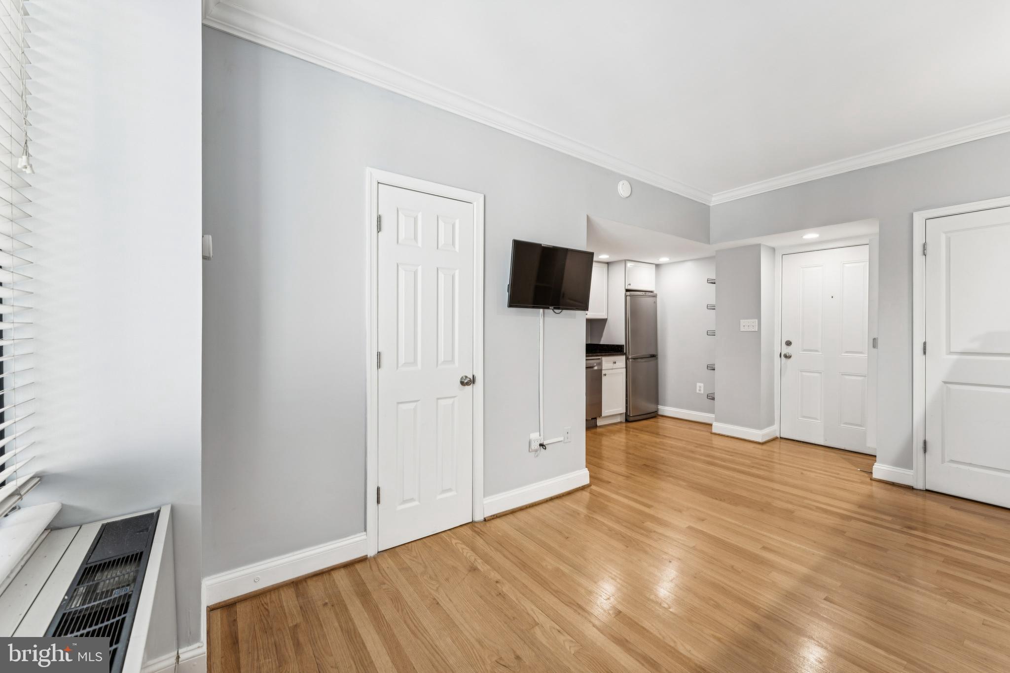 1701 16th Street Northwest, Unit 304 Washington, DC 20009 - Photo 7 of 18 a view of empty room with wooden floor