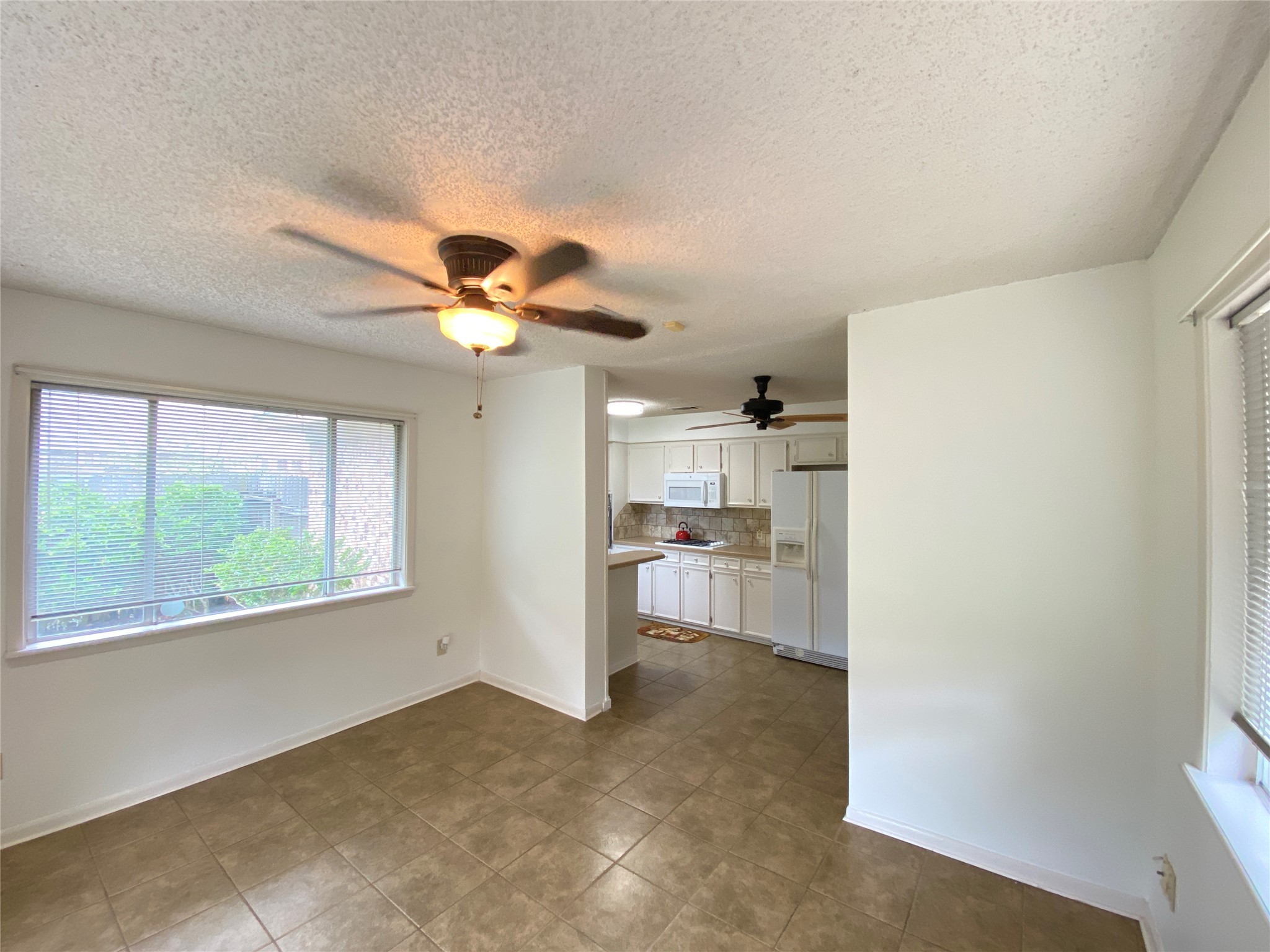 2233 Ripple Creek Drive Rosenberg, TX 77471 - Photo 17 of 39 a view of a livingroom with a ceiling fan and window