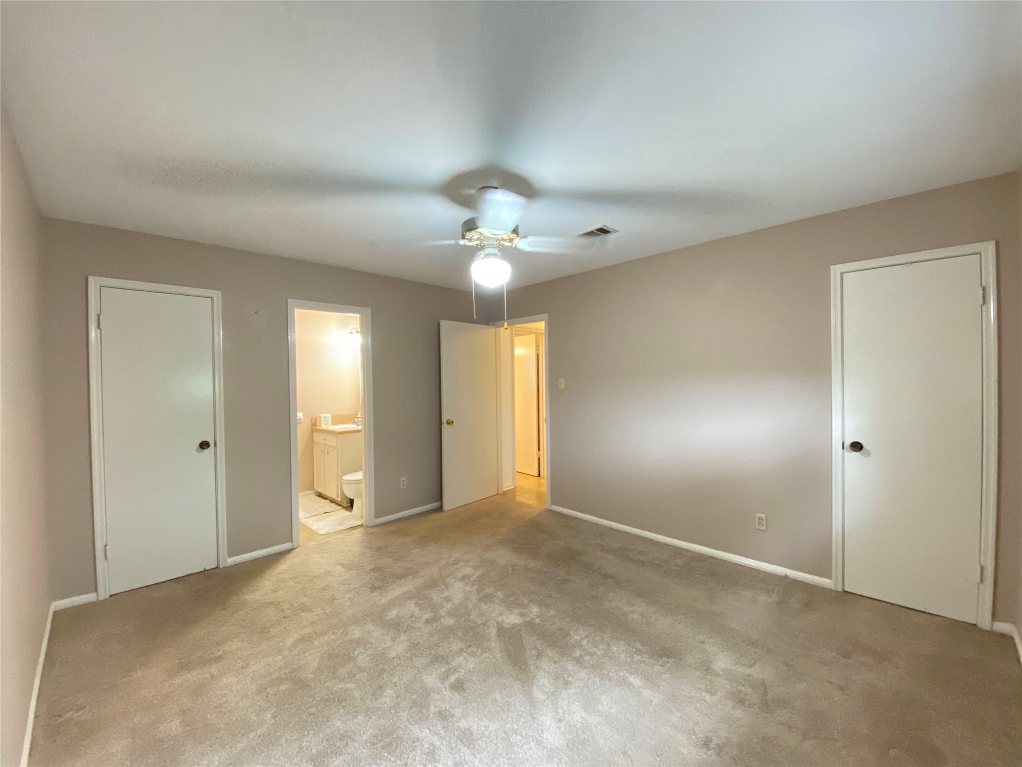 2233 Ripple Creek Drive Rosenberg, TX 77471 - Photo 31 of 39 a view of an empty room with a chandelier fan