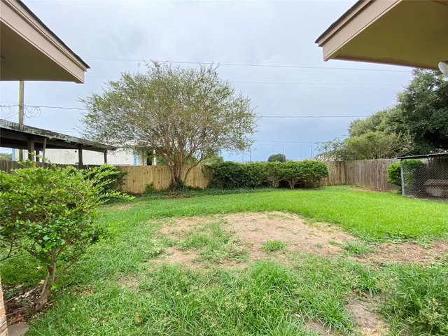 a front view of house with a garden