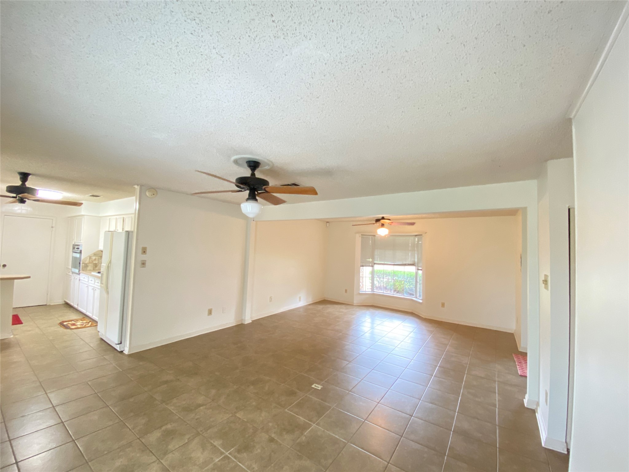 2233 Ripple Creek Drive Rosenberg, TX 77471 - Photo 10 of 39 an empty room with a empty space and windows