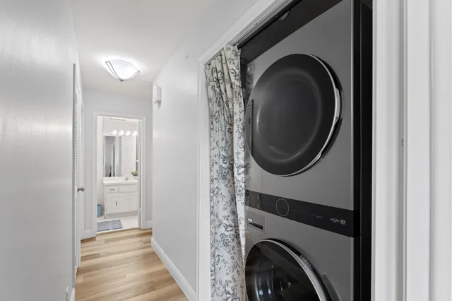 a view of a hallway with washer and dryer