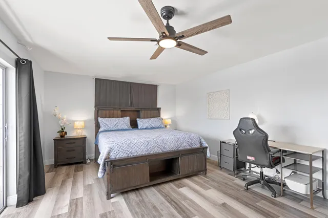 a bedroom with a bed and cabinets