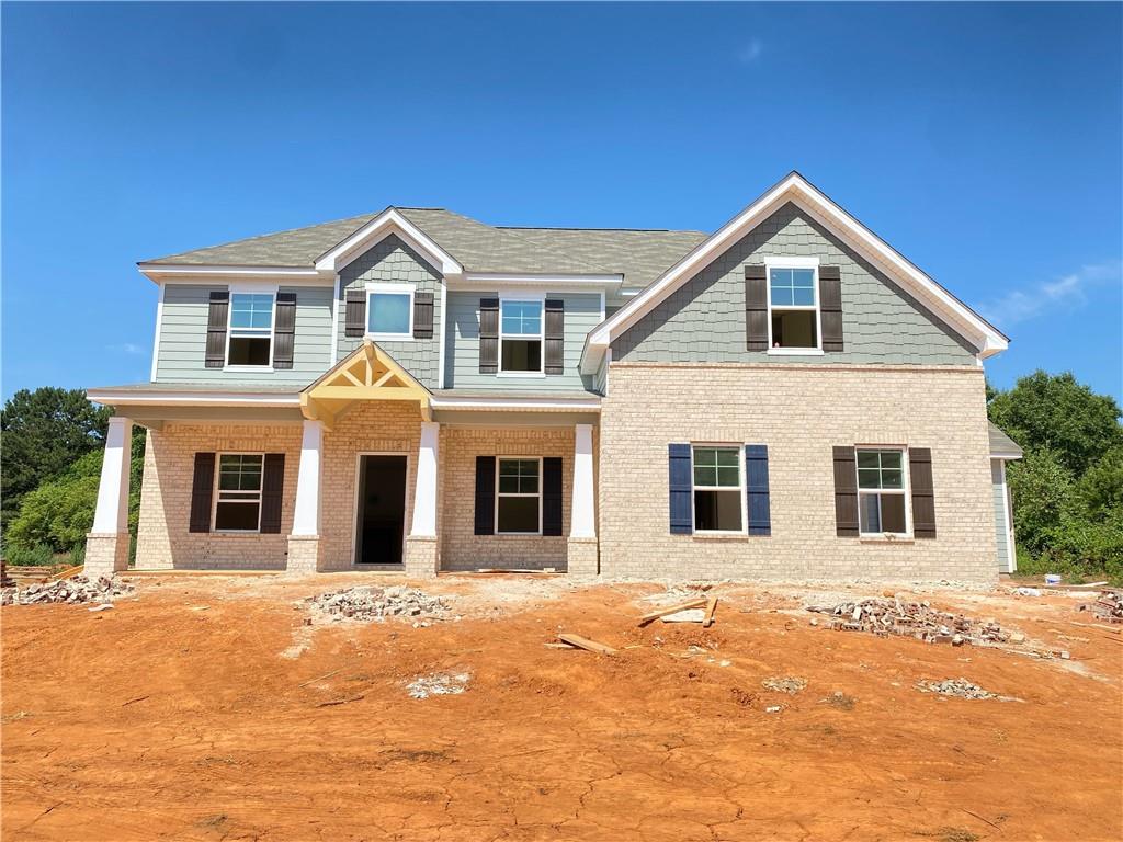 a view of a white house with a yard