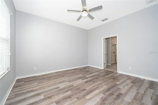 a view of an empty room with a window