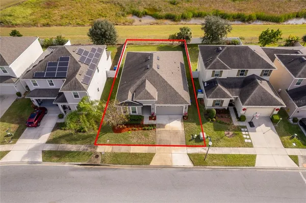 a bird view of a house with a swimming pool