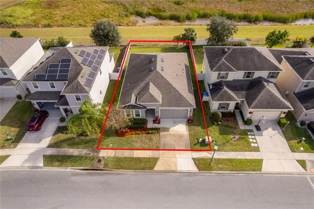 a bird view of a house with a swimming pool