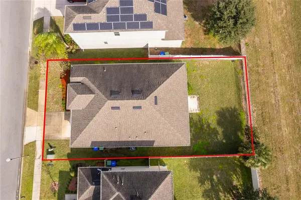 an aerial view of a highlighted house