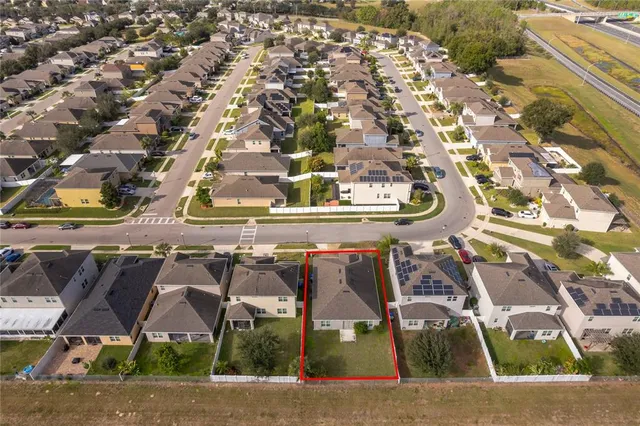 an aerial view of a highlighted house