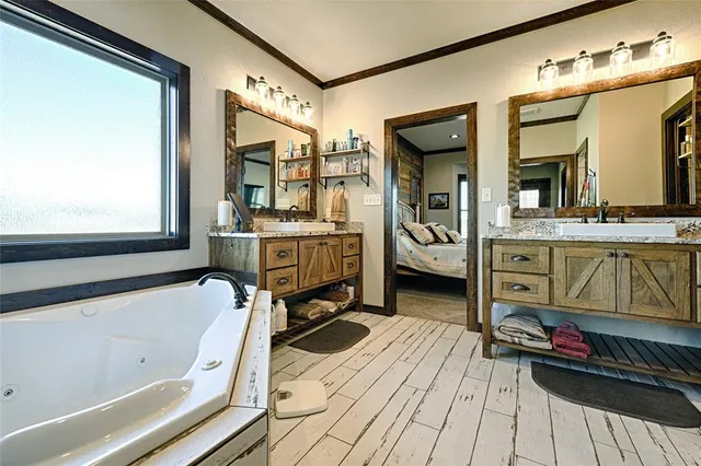 a view of a bedroom with furniture and window