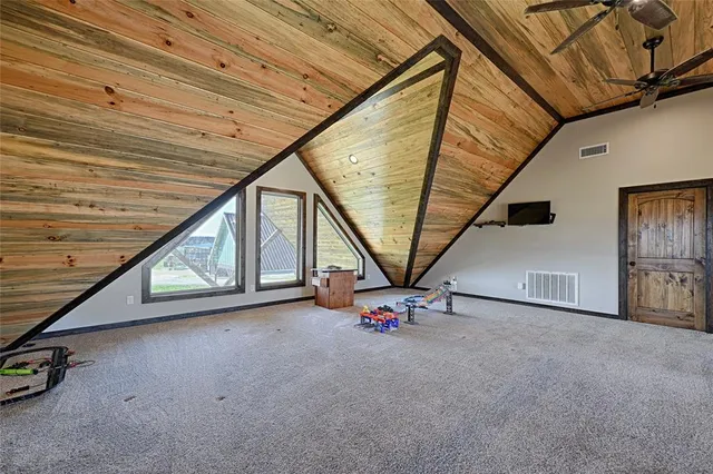 a view of an empty room with windows