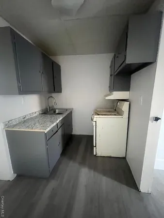 a kitchen with a stove and a refrigerator