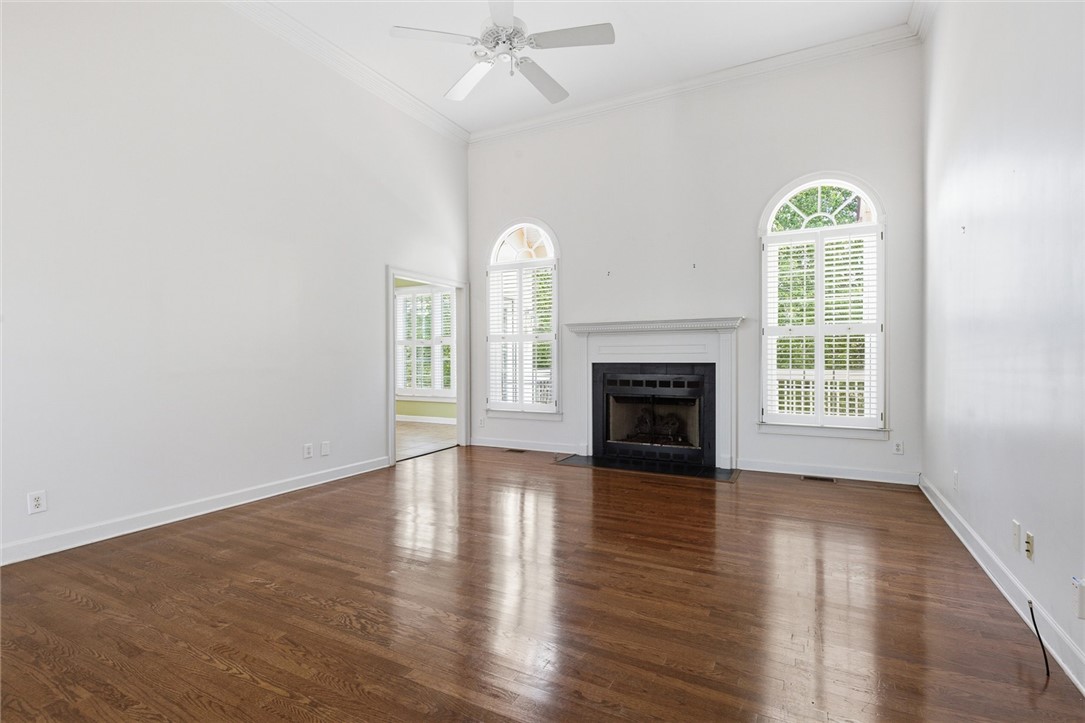 110 Garden Gate Drive Anderson, SC 29621 - Photo 13 of 35 This living area features a grand fireplace and high ceilings.