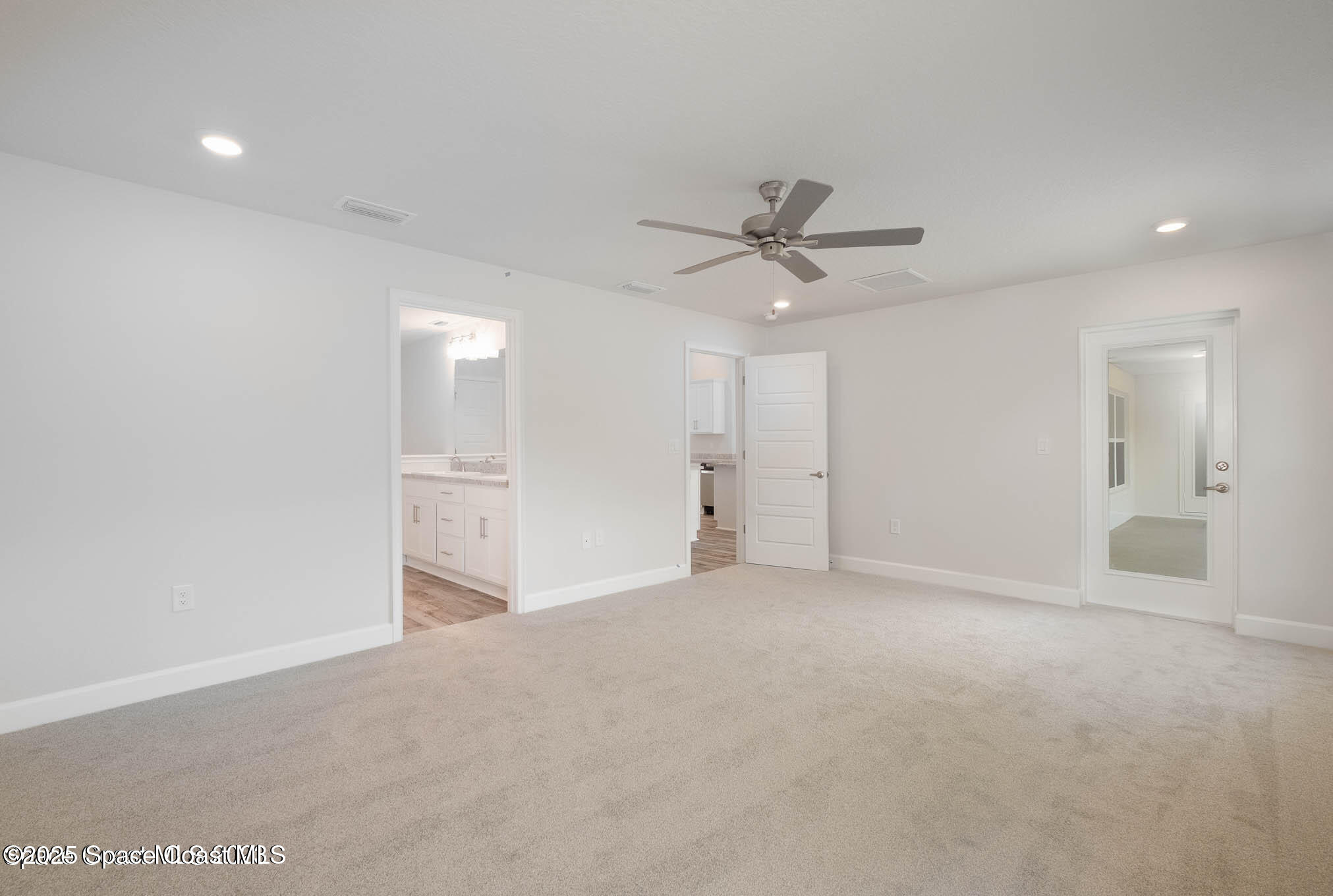 517 Winer Avenue Southwest Palm Bay, FL 32908 - Photo 13 of 15 a view of an empty room with a ceiling fan