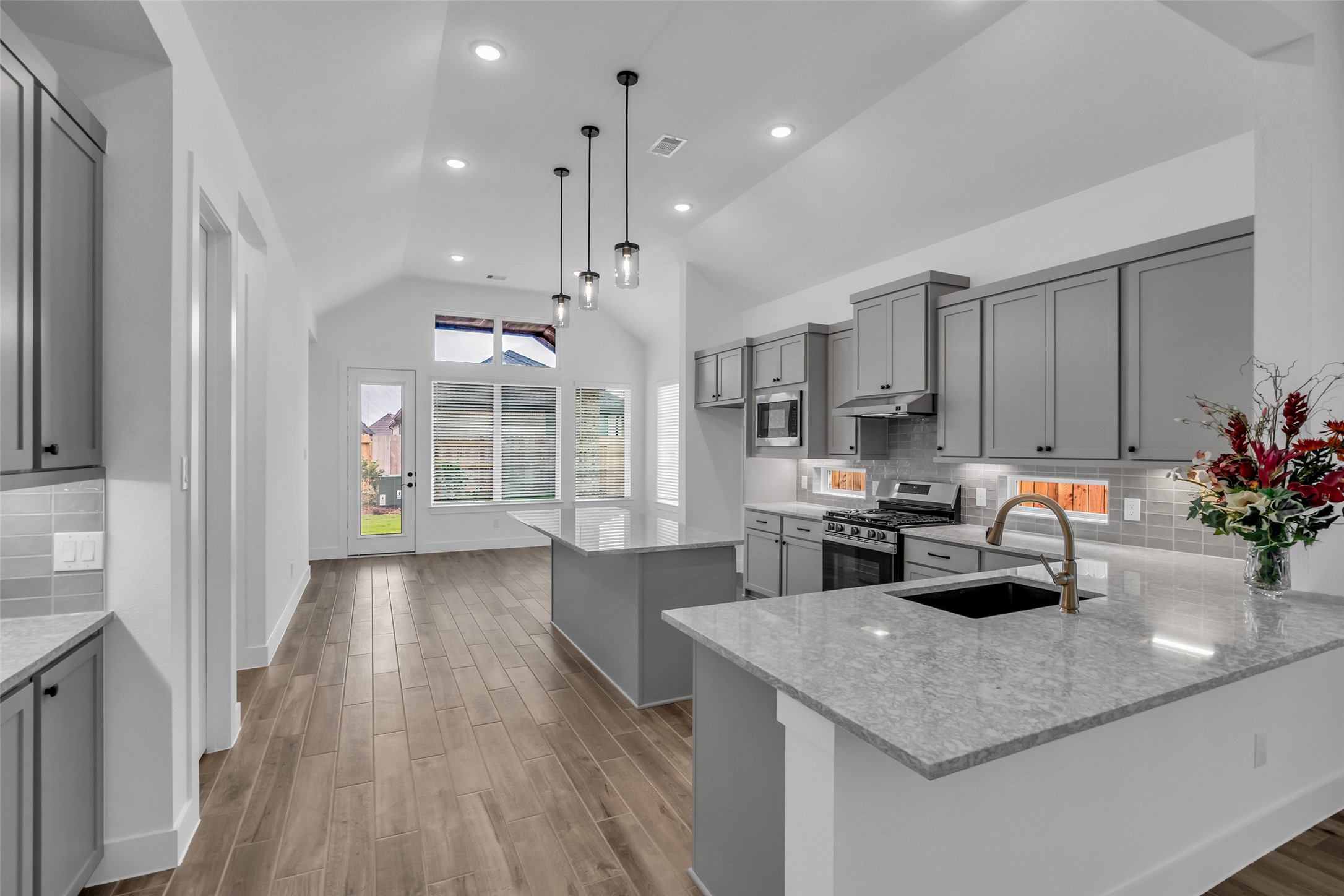 143 Afton June Drive Rosenberg, TX 77471 - Photo 11 of 25 a kitchen with a sink a counter space and stainless steel appliances