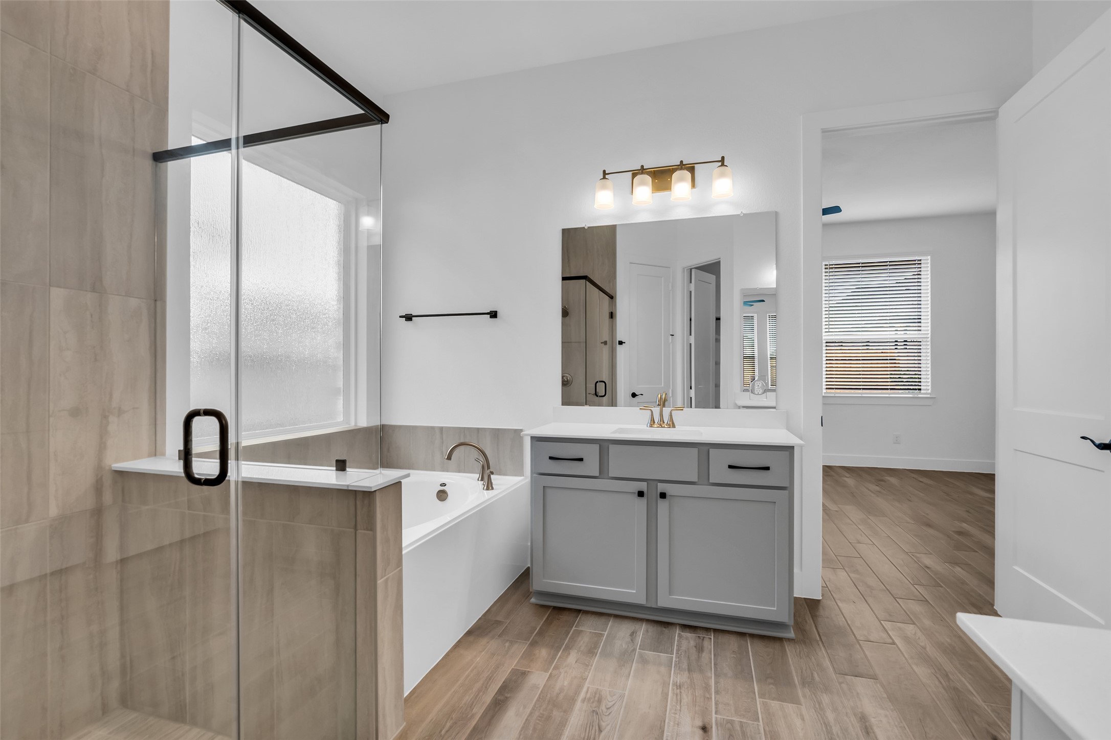 143 Afton June Drive Rosenberg, TX 77471 - Photo 19 of 25 a bathroom with a tub sink and mirror