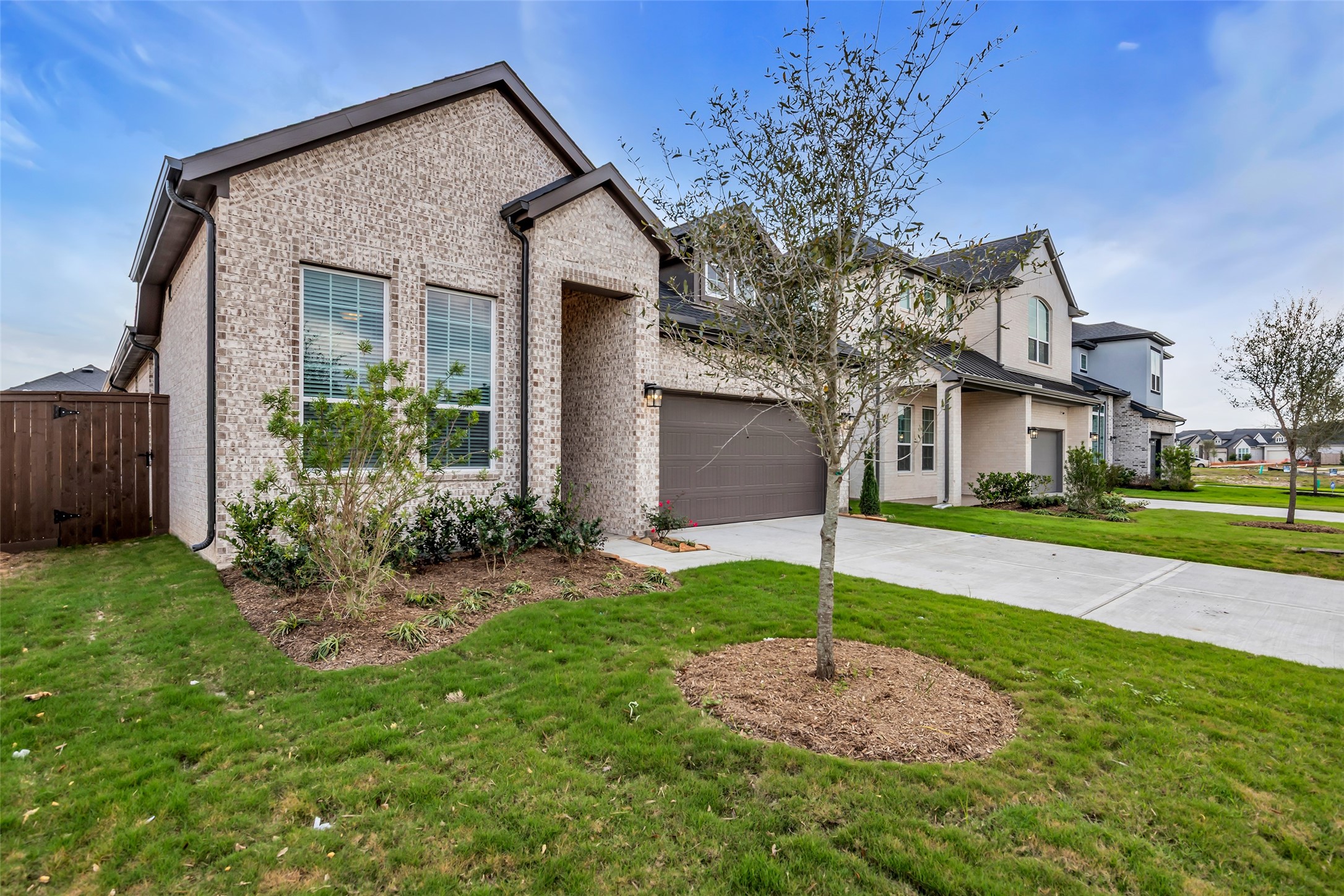 143 Afton June Drive Rosenberg, TX 77471 - Photo 2 of 25 a front view of a house with a yard and garage
