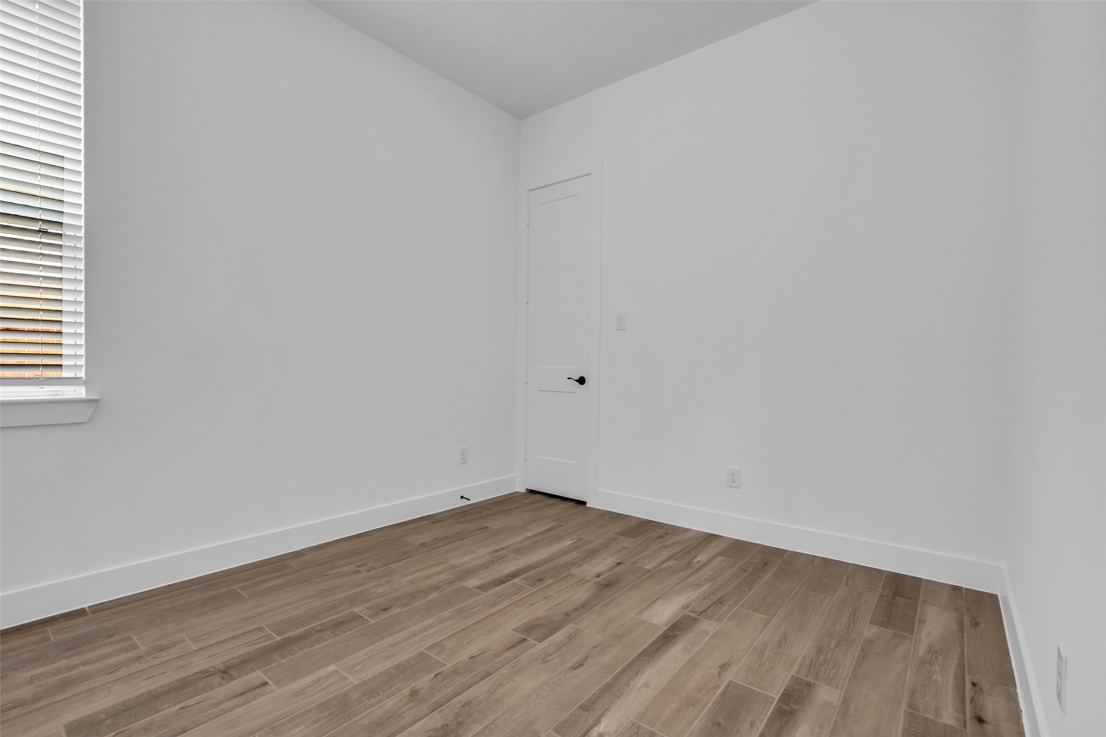 143 Afton June Drive Rosenberg, TX 77471 - Photo 22 of 25 a view of an empty room with wooden floor