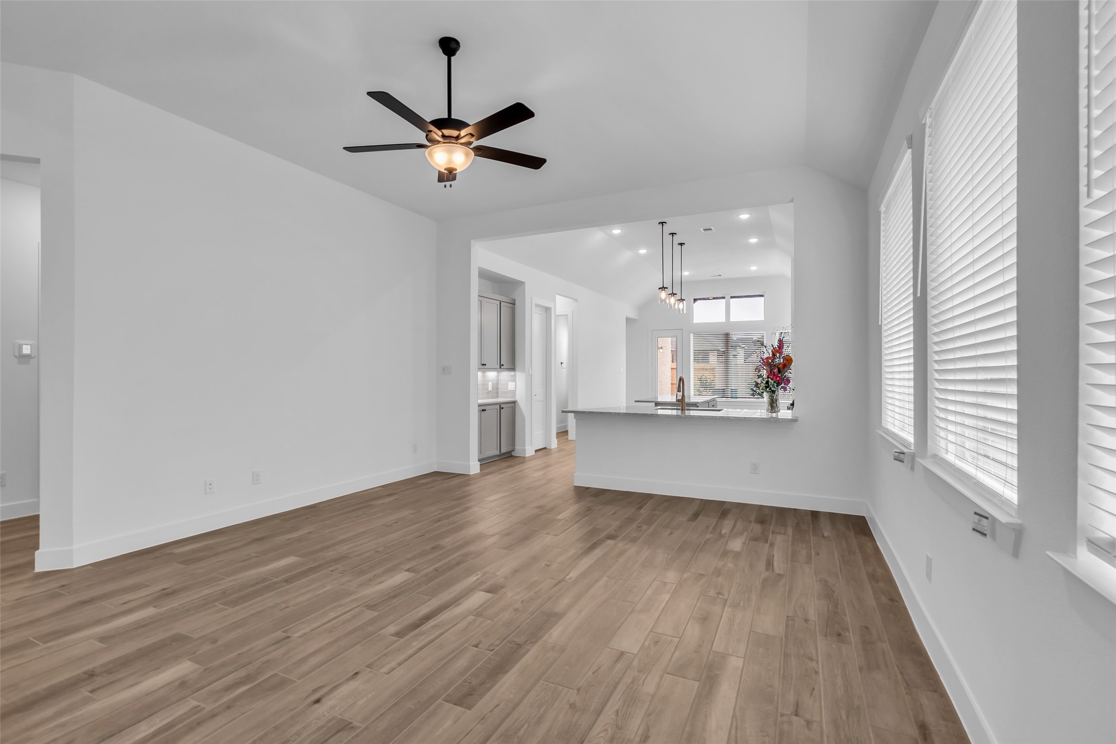 143 Afton June Drive Rosenberg, TX 77471 - Photo 4 of 25 a view of an empty room with wooden floor and a window