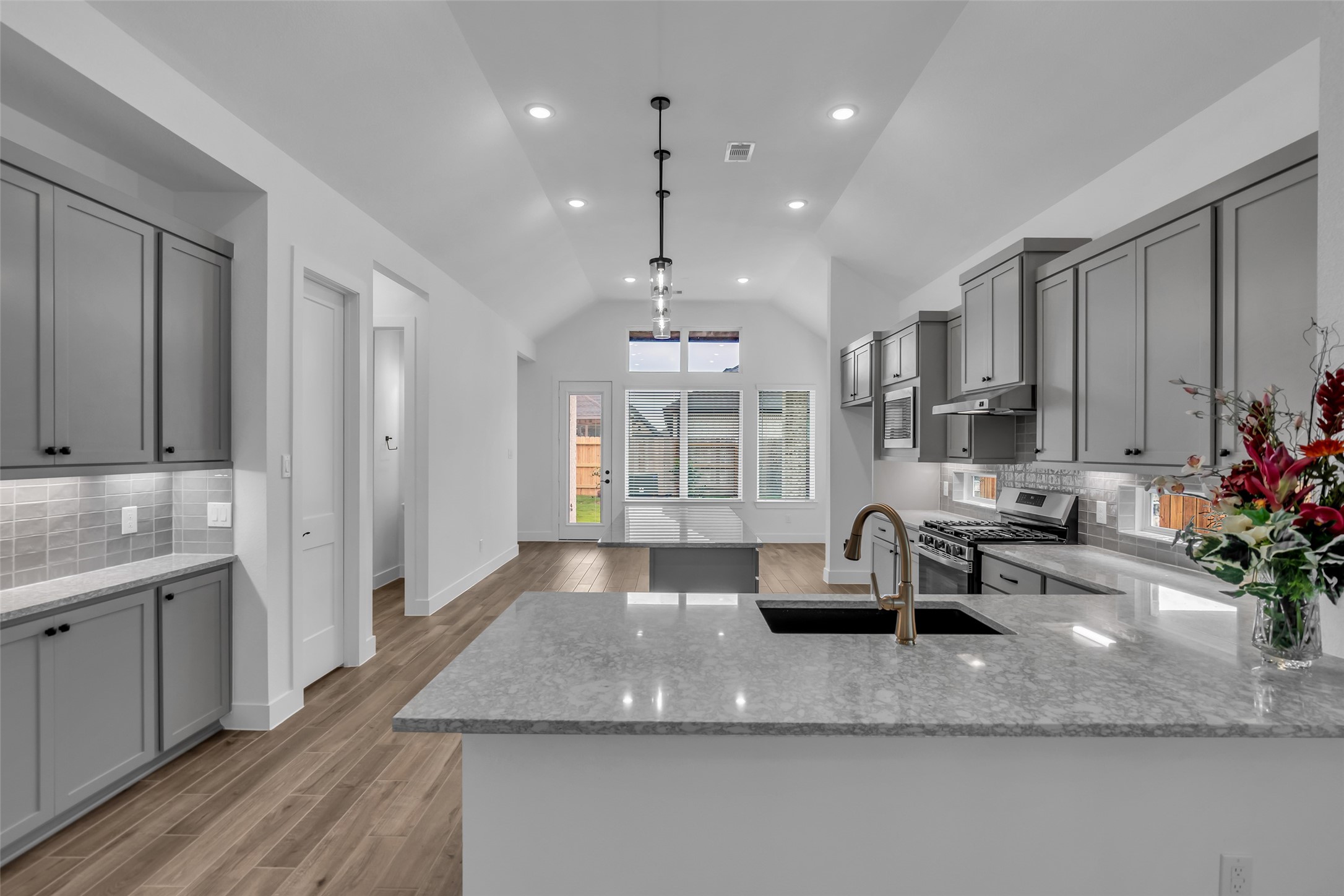 143 Afton June Drive Rosenberg, TX 77471 - Photo 5 of 25 a view of a kitchen with granite countertop a large counter top appliances and cabinets