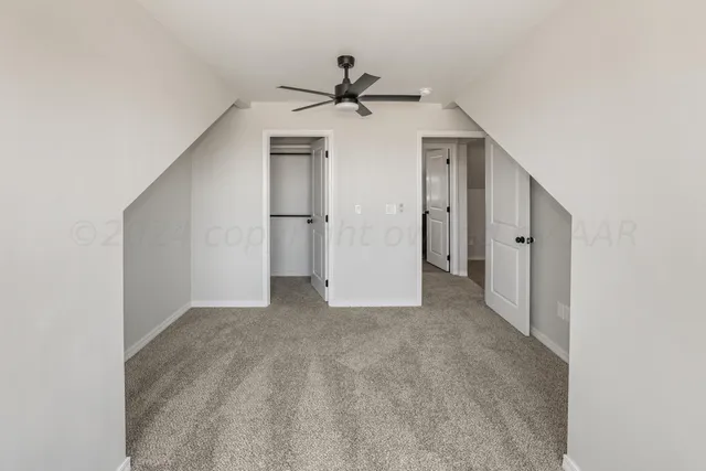a bathroom with a granite countertop sink a toilet and a bathtub
