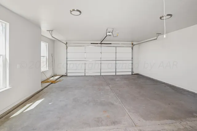 a view of house with backyard and garden