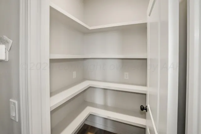 a view of an empty walk in closet