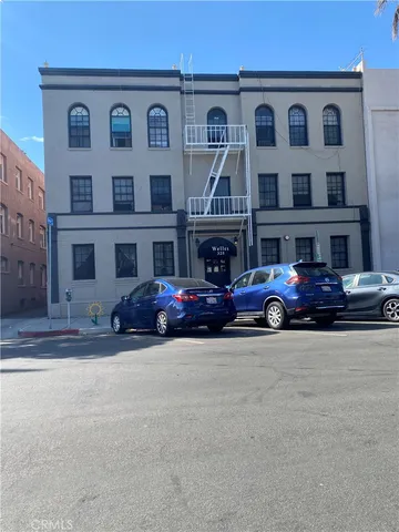 a view of a car parked in front of a building
