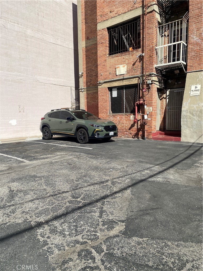 325 Elm Avenue, Unit 106 Long Beach, CA 90802 - Photo 9 of 9 a car parked in front of a building
