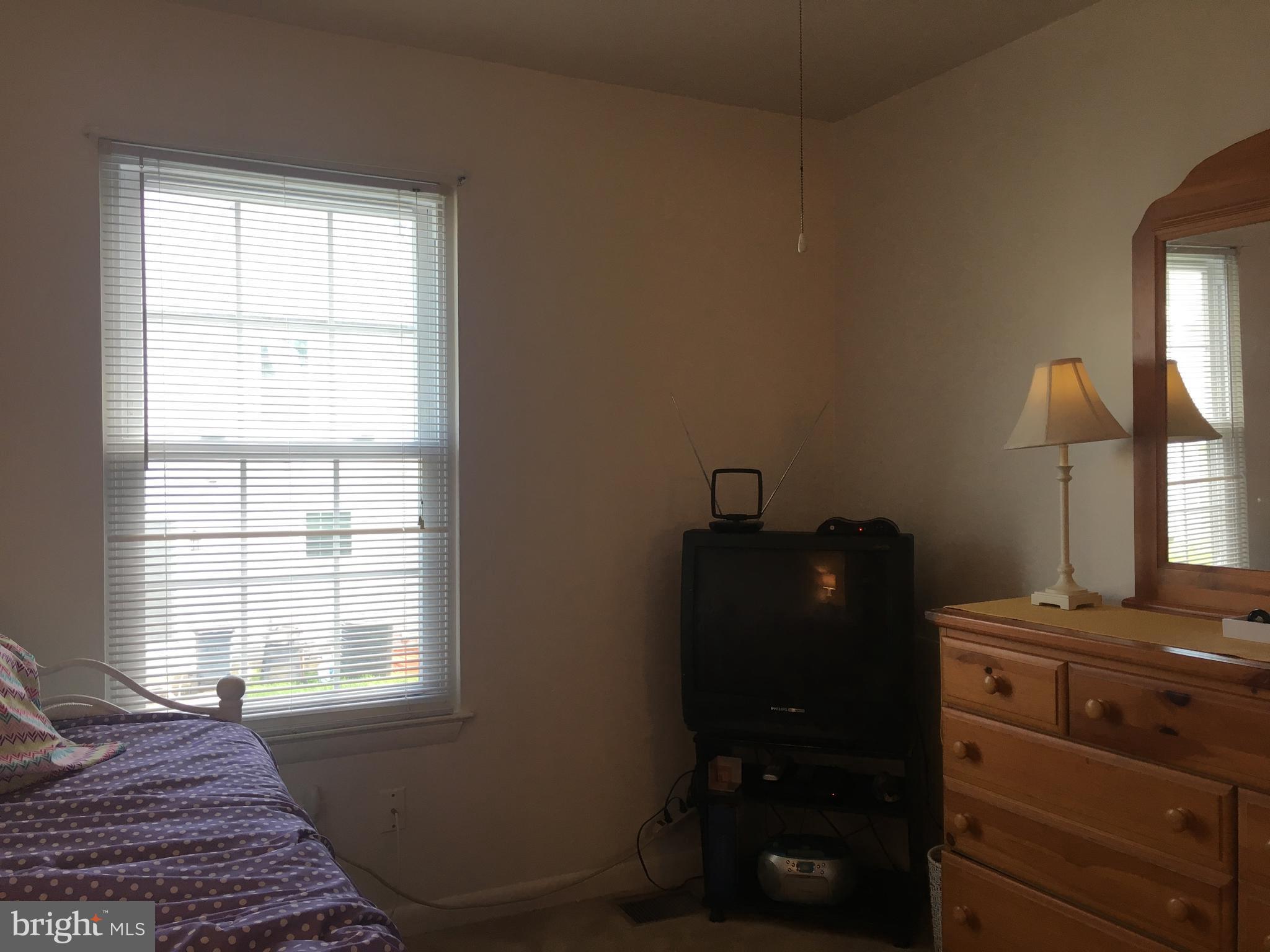 7110 Rutherford Green Circle Baltimore, MD 21244 - Photo 19 of 26 a bed room with a bed and a window