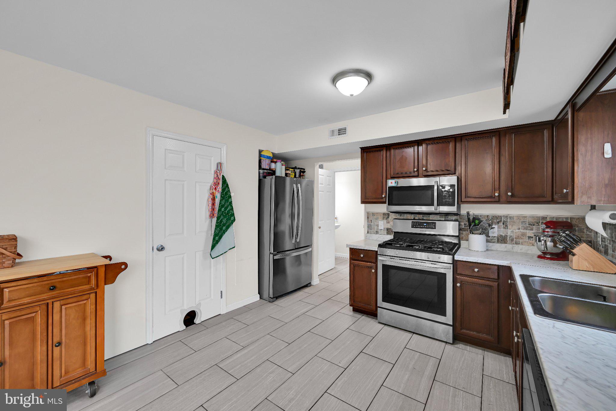 387 Oneida Drive Reading, PA 19608 - Photo 9 of 27 Modern kitchen with sleek finishes.