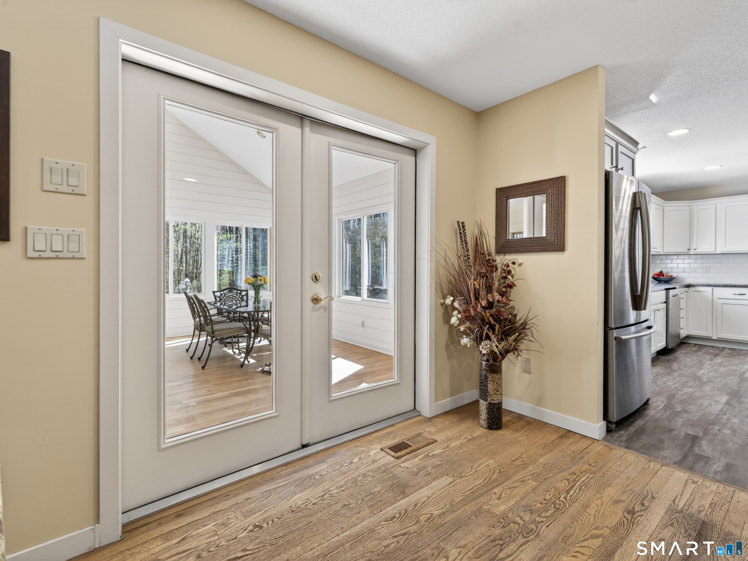 29 Welsch Farms Road Killingworth, CT 06419 - Photo 14 of 40 Doors to sunroom from family room