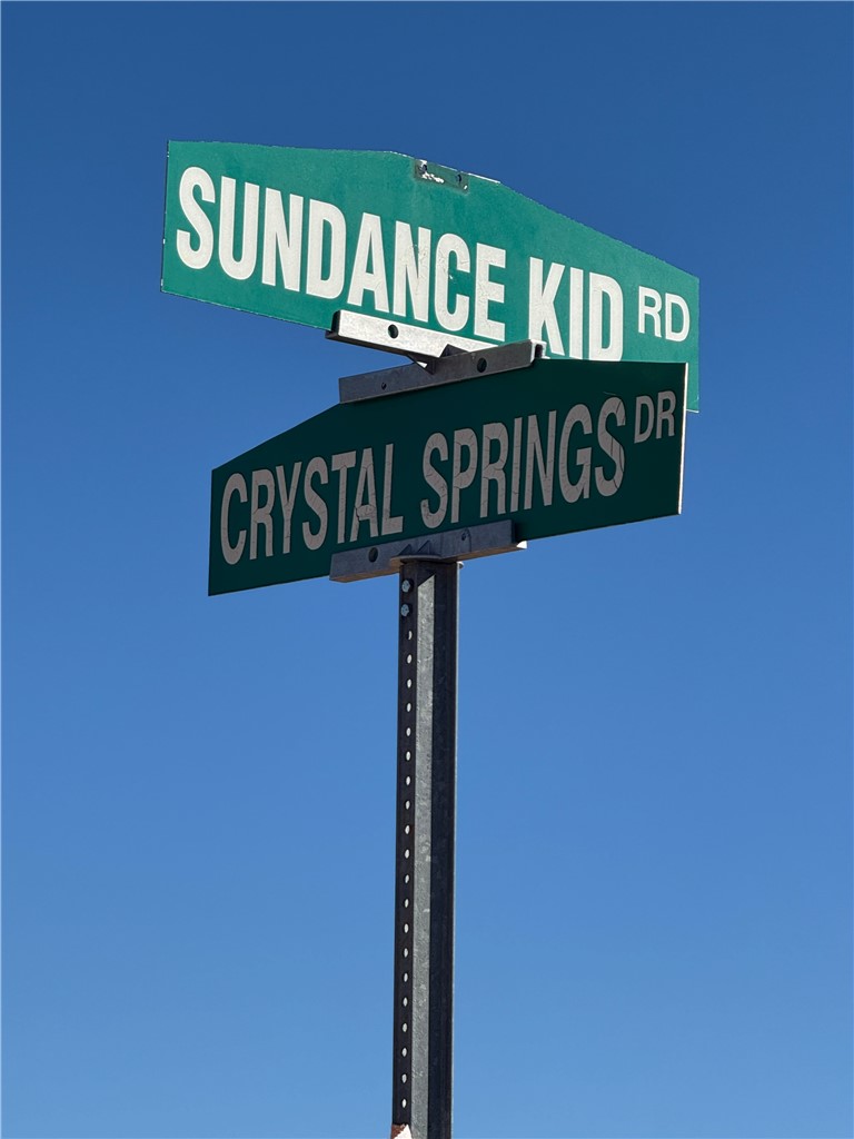 242-03-004 South Sundance Kid Road Yucca, AZ 86438 - Photo 6 of 19 a close up of a street sign