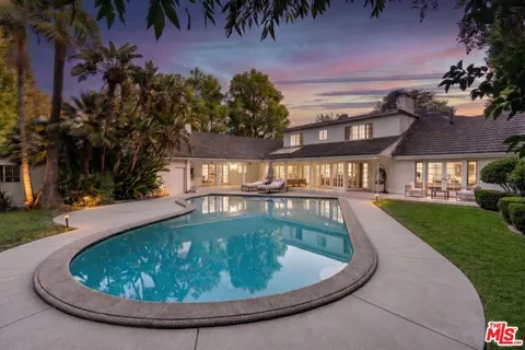 a view of a house with a swimming pool