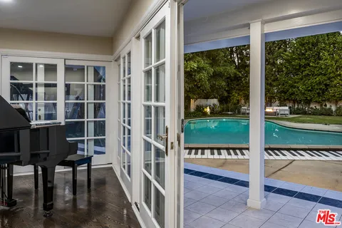 a view of a room with yard from balcony
