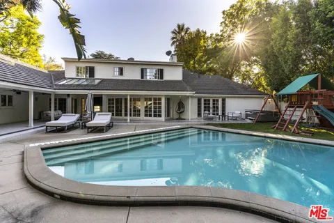 a view of a house with swimming pool