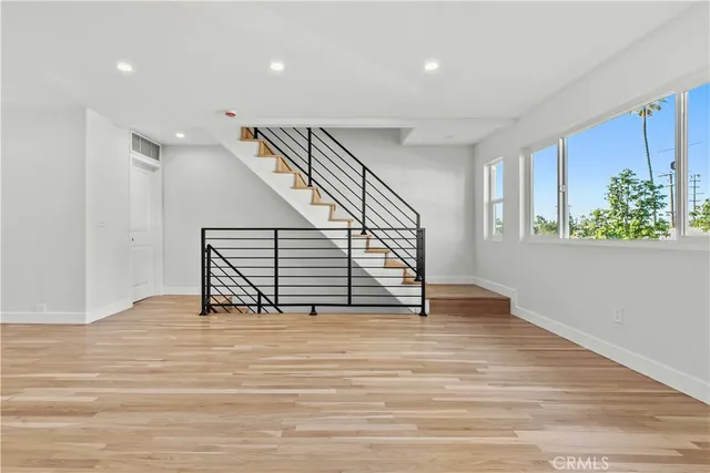 a view of an entryway with wooden floor