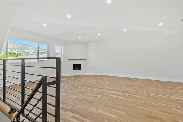 a living room with furniture and a piano