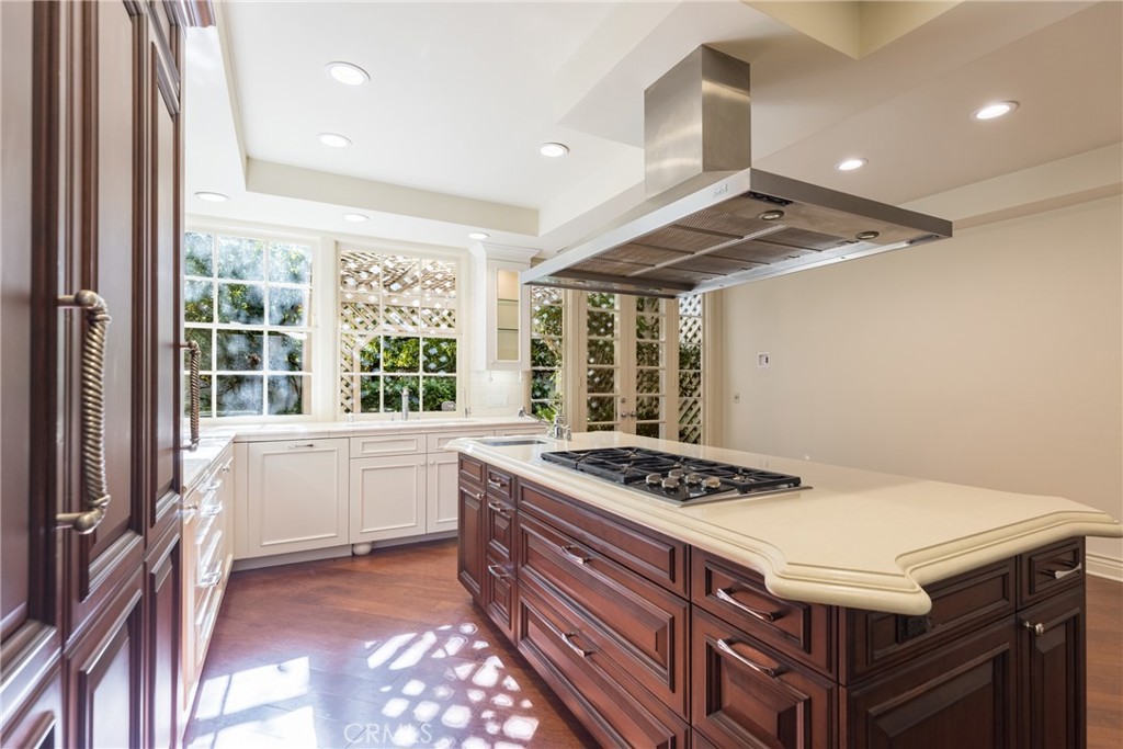 12386 Ridge Circle Los Angeles, CA 90049 - Photo 16 of 56 a kitchen with a stove a sink and a refrigerator