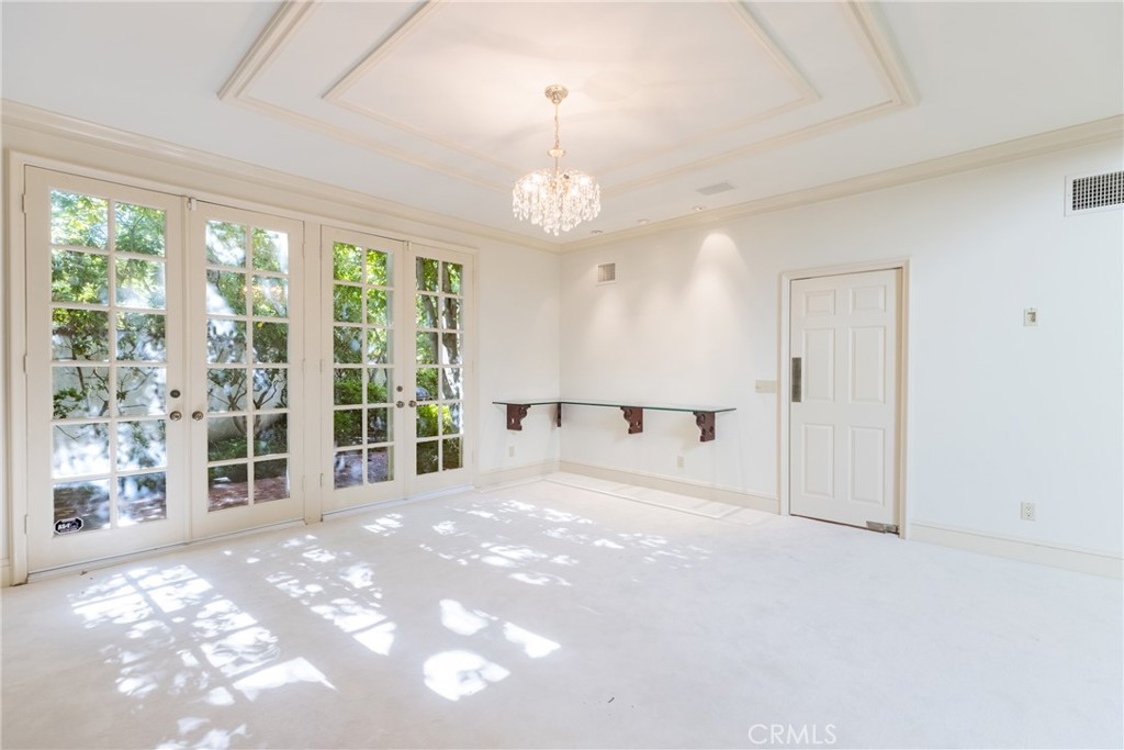 12386 Ridge Circle Los Angeles, CA 90049 - Photo 18 of 56 a view of an empty room with a window