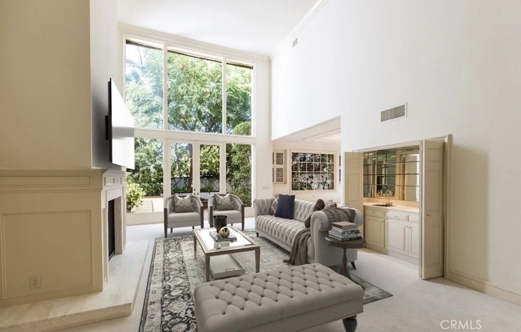 12386 Ridge Circle Los Angeles, CA 90049 - Photo 23 of 56 a living room with furniture and a large window