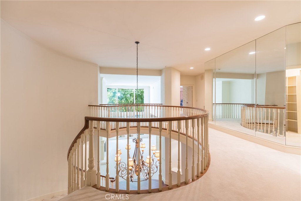 12386 Ridge Circle Los Angeles, CA 90049 - Photo 25 of 56 a view of staircase with large window