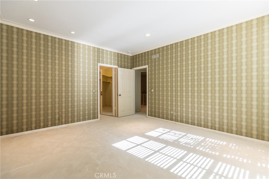 12386 Ridge Circle Los Angeles, CA 90049 - Photo 28 of 56 a view of an empty room with wooden walls