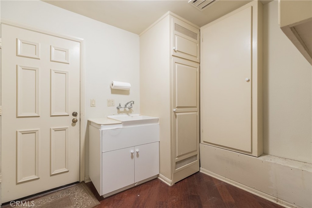 12386 Ridge Circle Los Angeles, CA 90049 - Photo 46 of 56 a bathroom with a sink and a mirror