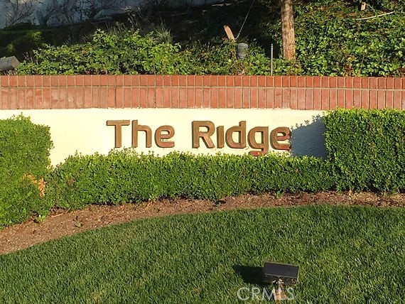 12386 Ridge Circle Los Angeles, CA 90049 - Photo 55 of 56 a sign that is sitting on a wooden fence