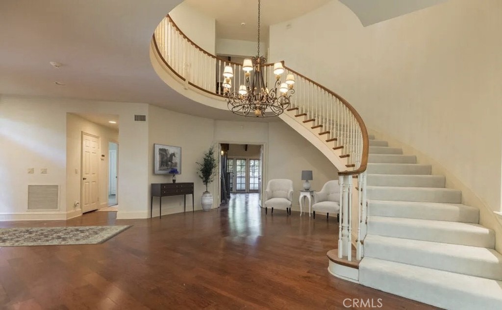 12386 Ridge Circle Los Angeles, CA 90049 - Photo 9 of 56 a view of entryway and hall with wooden floor