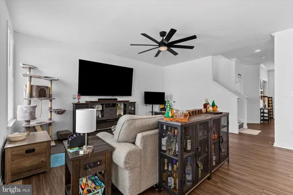a view of a livingroom with furniture and a flat screen tv