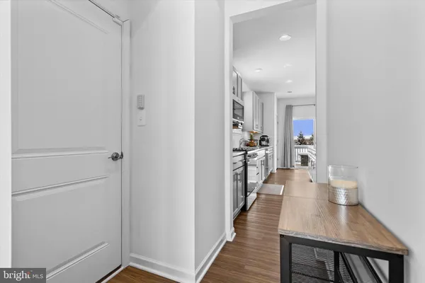 a dining room with furniture and wooden floor