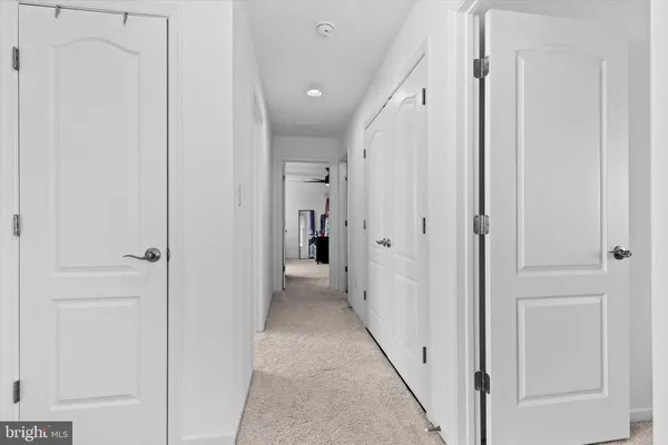 a view of hallway with white doors